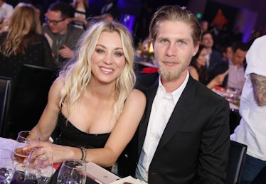 Kaley Cuoco in a black dress and Karl Cook in a white shirt and a black blazer at a dinner 