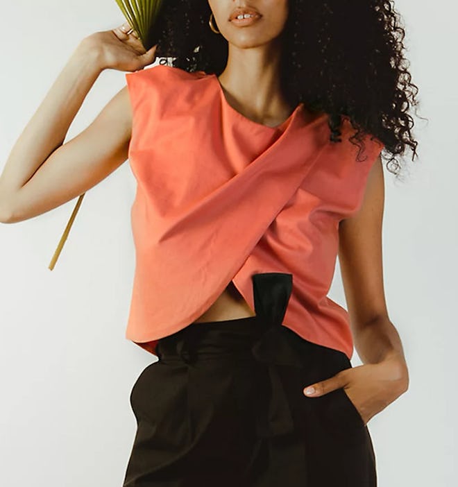 an asymmetrical crossover nursing shirt in a coral color