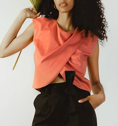 an asymmetrical crossover nursing shirt in a coral color