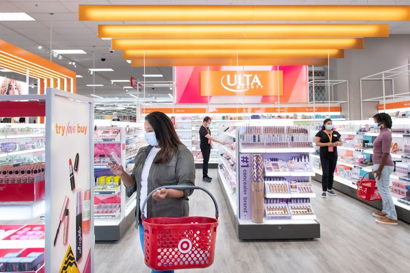 Shoppers and associates shop for beauty products from Ulta Beauty at Target