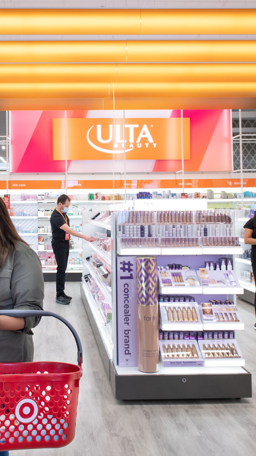 Shoppers and associates shop for beauty products from Ulta Beauty at Target
