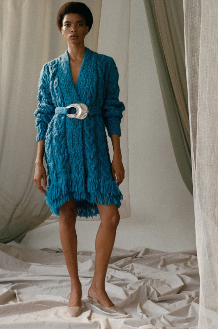 A model wearing a blue sweater dress by Alejandra Alonso Rojas during the NYFW Spring 2022
