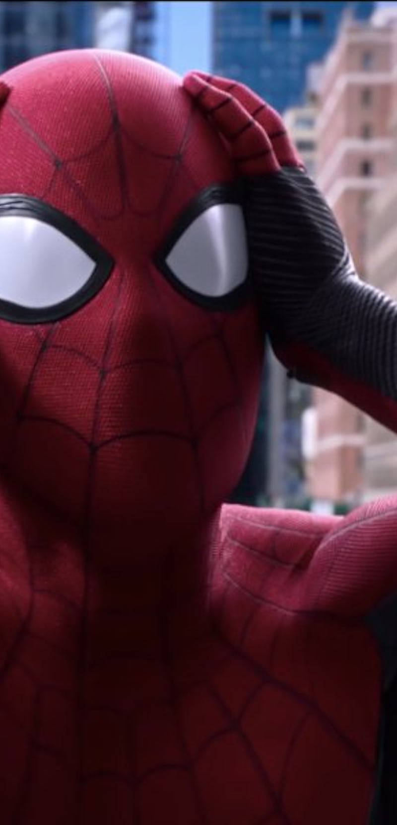 Spider-Man holding his head with his hands