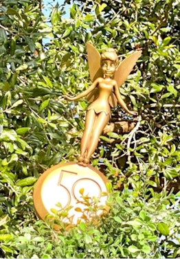 These photos of Disney's gold statutes for the 50th anniversary include Tinkerbell.