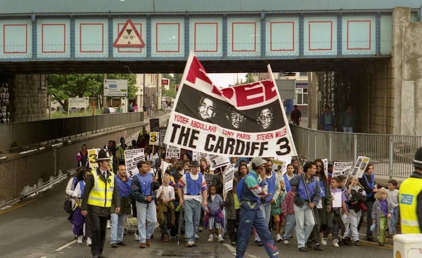 A protest march leaves Butetown on its way to Cardiff prison.