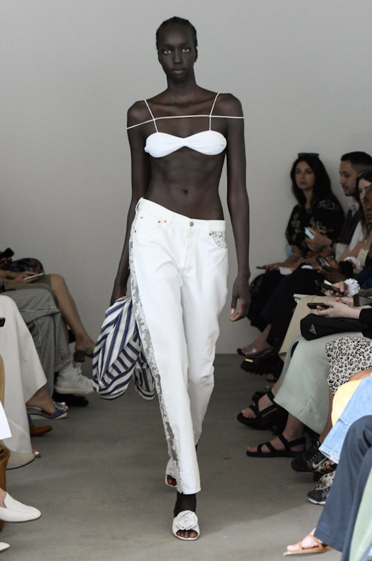 A model wearing a white bra and pants by Maryam Nassir Zadeh during the NYFW Spring 2022