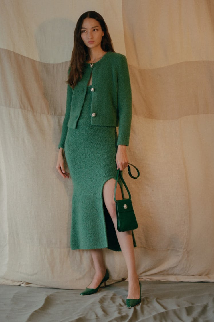 A model wearing a green set by Alejandra Alonso Rojas during the NYFW Spring 2022
