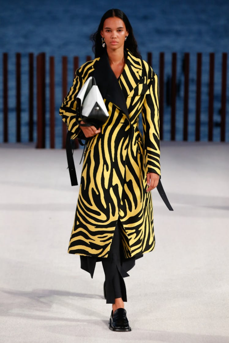 A model wearing a yellow-and-black zebra print coat by Proenza Schouler during the NYFW Spring 2022