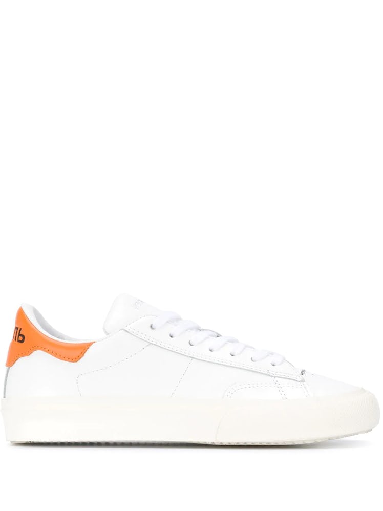 Heron Preston white sneakers.