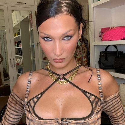 Bella Hadid poses with her hair parted into a zigzag shape.