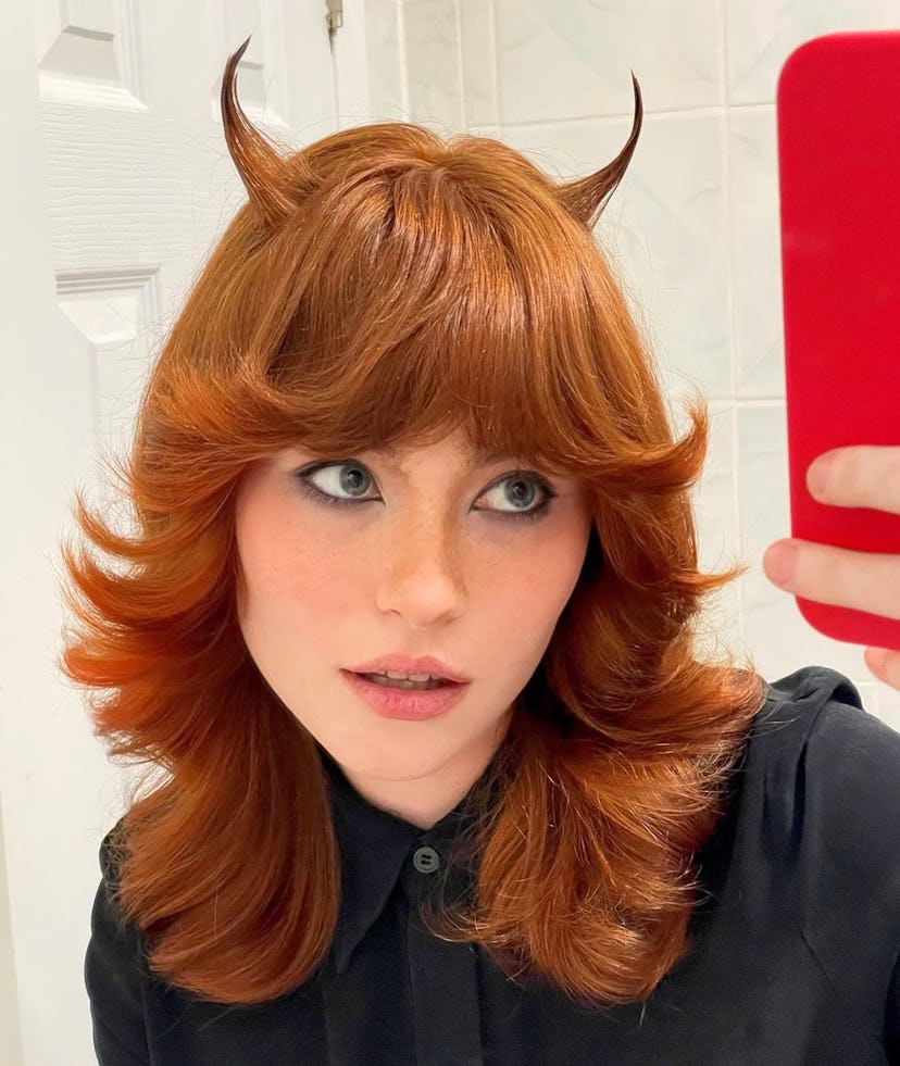 Musician Allison Ponthier shows off her hair, styled into two "devil horns."