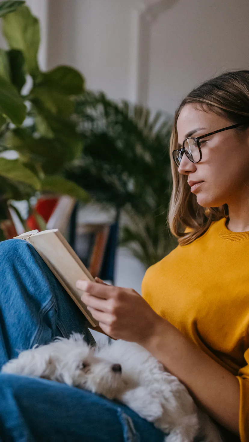 A woman reads a book.