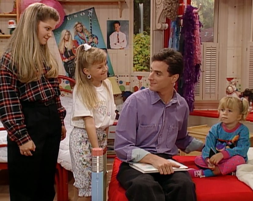 Danny Tanner sits with Michelle, Stephanie, and DJ.