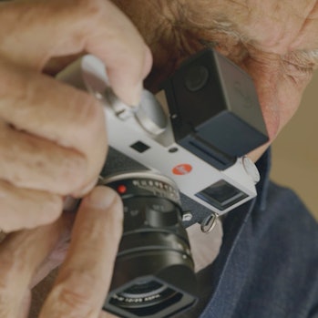 American photographer Ralph Gibson using the external electronic Visoflex viewfinder on the Leica M1...