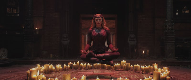 Elizabeth Olsen meditating surrounded by candles as Scarlet Witch 