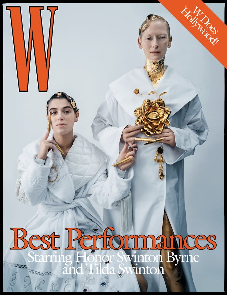Tilda Swinton and Honor Swinton Byrne in white coats, with gold talons on the cover of W Magazine's ...