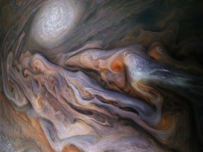 enhanced image of cyclones in Jupiter's atmosphere