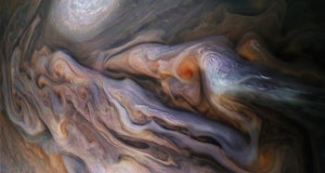 enhanced image of cyclones in Jupiter's atmosphere
