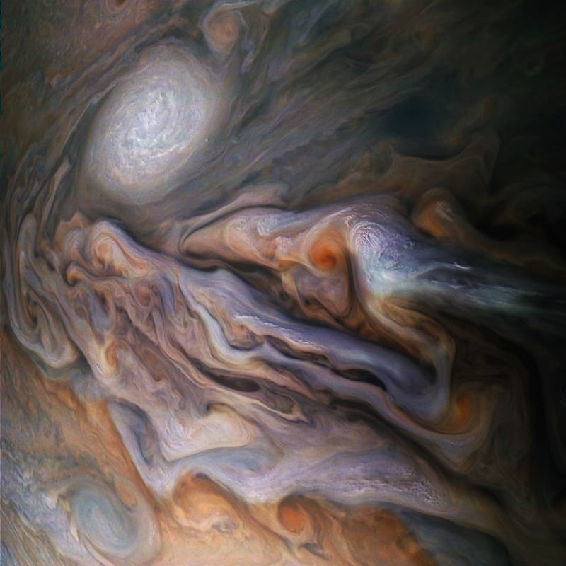 enhanced image of cyclones in Jupiter's atmosphere