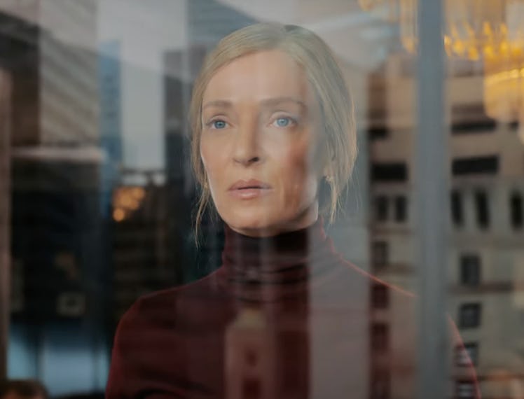 Uma Thurman staring out a window