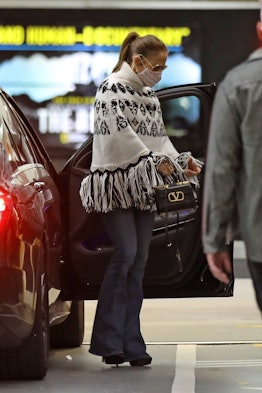 Jennifer Lopez wearing flared jeans. 
