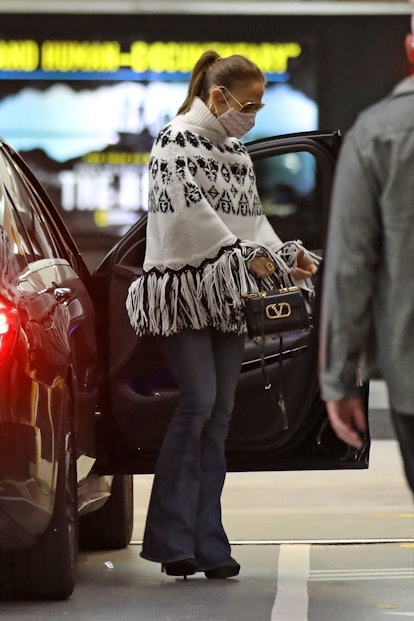 Jennifer Lopez wearing flared jeans. 
