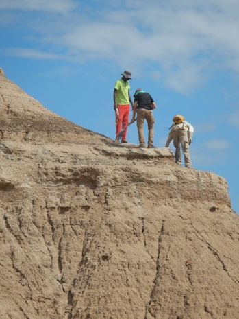 Researchers standing near Omo I site