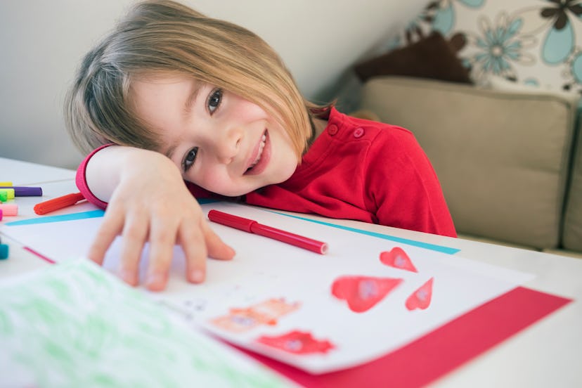child making valentine's day card in article about valentine's day poems for kids