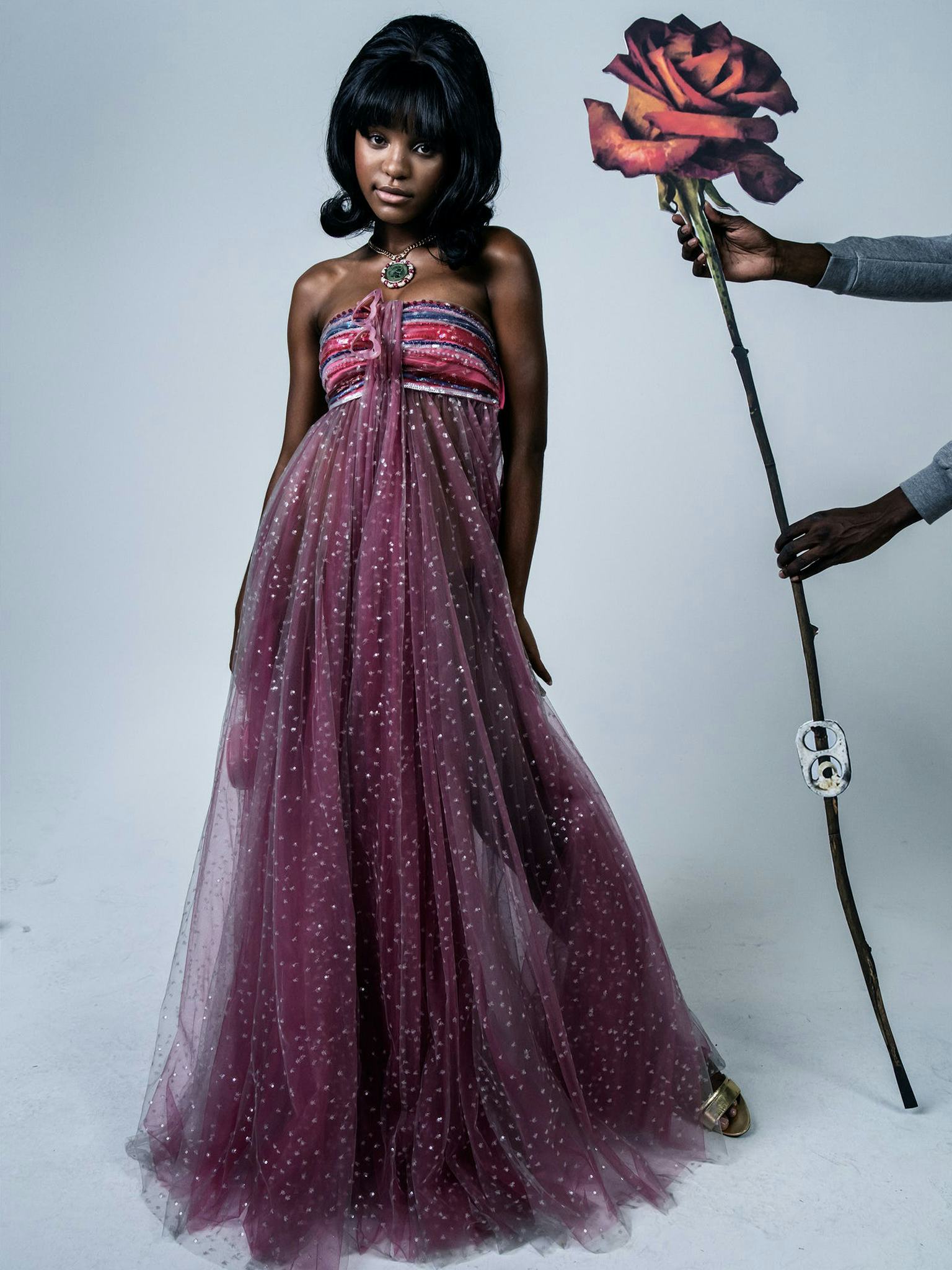 Saniyya Sidney in a purple dress, necklace, and gold sandals on the cover of W Magazine's Best Perfo...