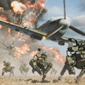 Image of Battlefield 2042 game: Robot military drones running on ground as plane flies above and exp...