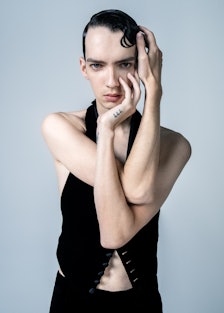 Kodi Smit-McPhee wears a Saint Laurent by Anthony Vaccarello vest and pants.