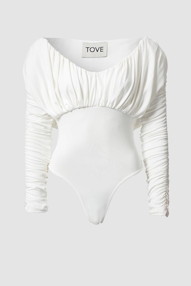 a white ruched bodysuit by Tove