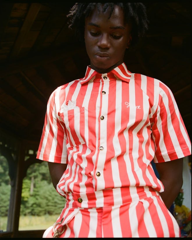 a red and white striped button down shirt by House of Aama