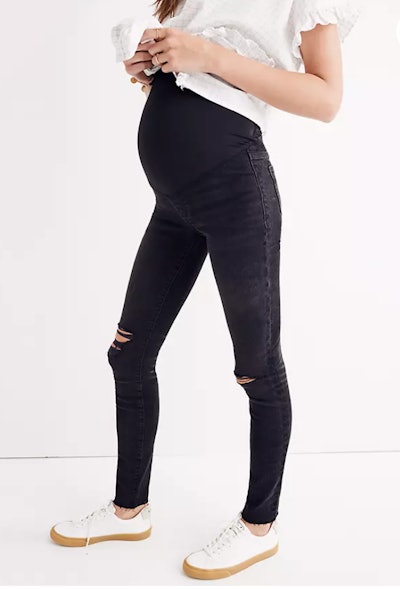 pregnant woman modeling maternity jeans