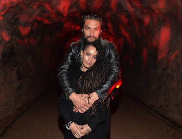 Jason Momoa holding Lisa Bonet
