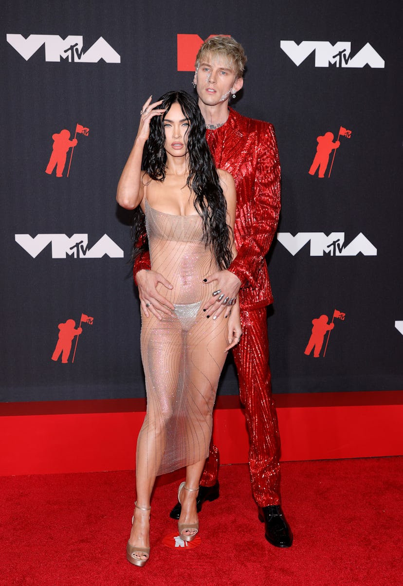 Megan Fox in a nude tulle dress and Machine Gun Kelly in a red sequin suit at the 2021 MTV Video Mus...