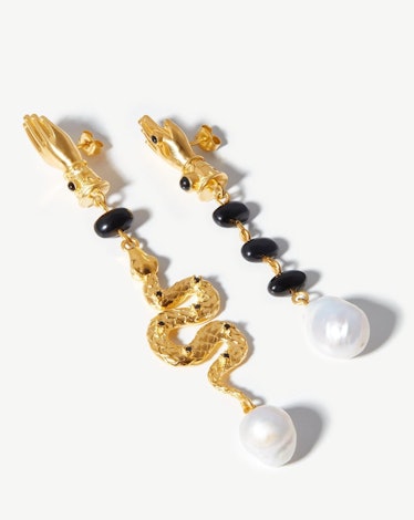 Missoma x Harris Reed asymmetrical gold earrings.