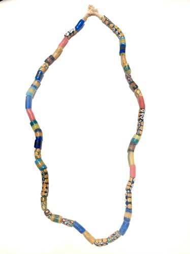 a beaded necklace by SVNR