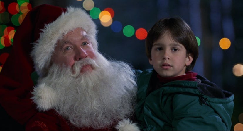 Tim Allen as Santa holding his son.
