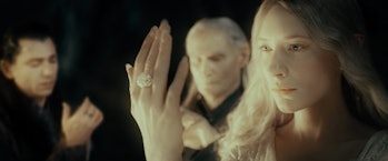 Galadriel (Cate Blanchett), Gil-galad, and (presumably) Círdan admiring their three Rings of Power i...