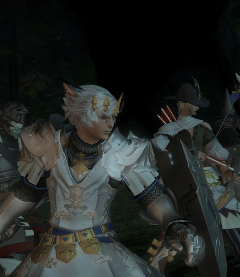 Image from FFXIV game showing a group of 7 different characters wearing armor and holding weapons ap...