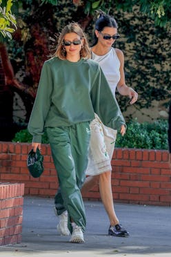 Hailey Bieber and Kendall Jenner wearing casual attire. 