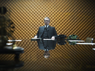 An insert from the trailer of Tinker Tailor Soldier Spy with a man sitting at a desk