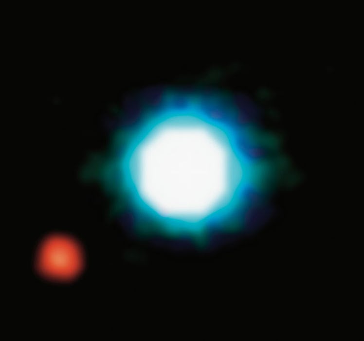 composite image shows an exoplanet (the red spot on the lower left), orbiting the brown dwarf 2M1207