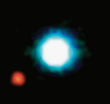composite image shows an exoplanet (the red spot on the lower left), orbiting the brown dwarf 2M1207