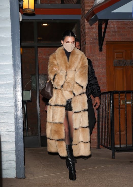 Kendall Jenner wears Khaite shearling coat.