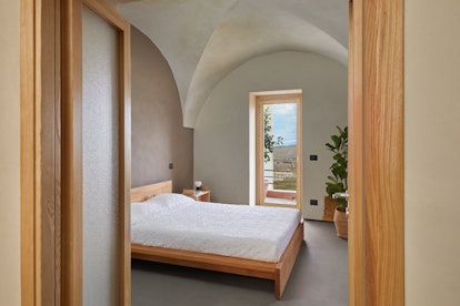 The bedroom in Airbnb's Sicily villa where you can live rent-free for a year overlooks the village o...