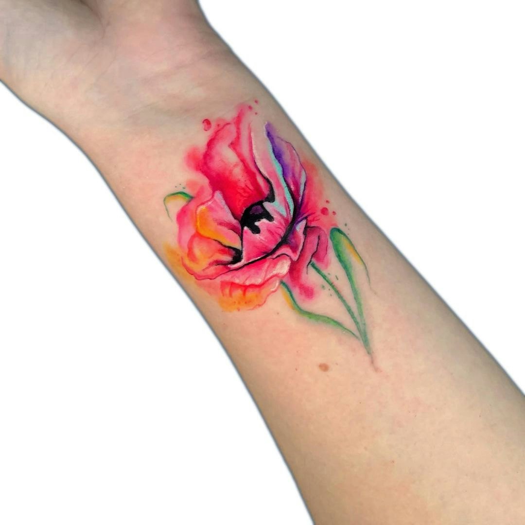 Watercolor rose tattoo on the wrist