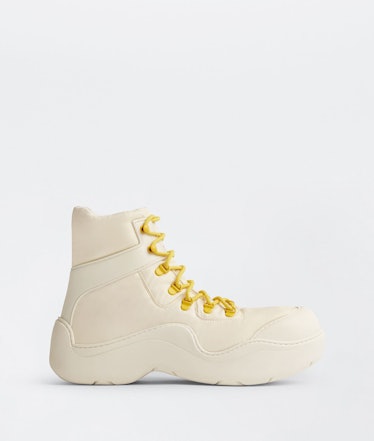 Bottega Veneta white and yellow Puddle Bomber boots.