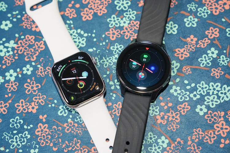 The Apple Watch and OnePlus Watch side-by-side